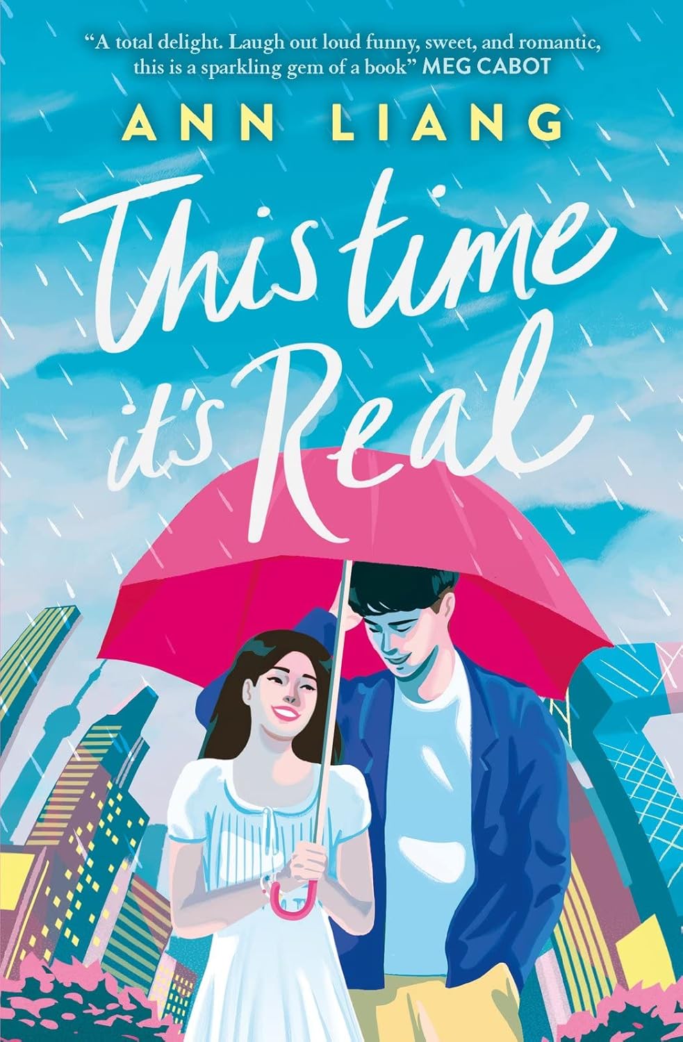 Book cover of 'This Time It's Real' by Ann Liang with a couple under an umbrella against a city skyline bret print quality in bookish wonderland