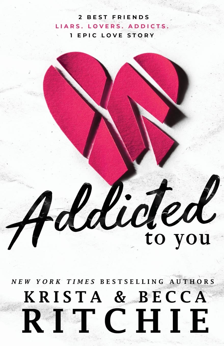 Book cover of 'Addicted to You' by Krista and Becca Ritchie with a pink heart design which is available in Bangladesh.