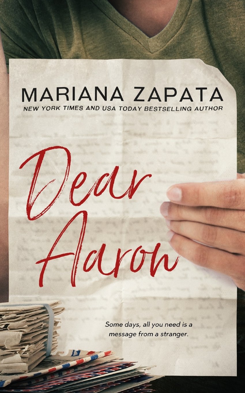Book cover of 'Dear Aaron' by Mariana Zapata held by a person which is available in Bookish Wonderland.