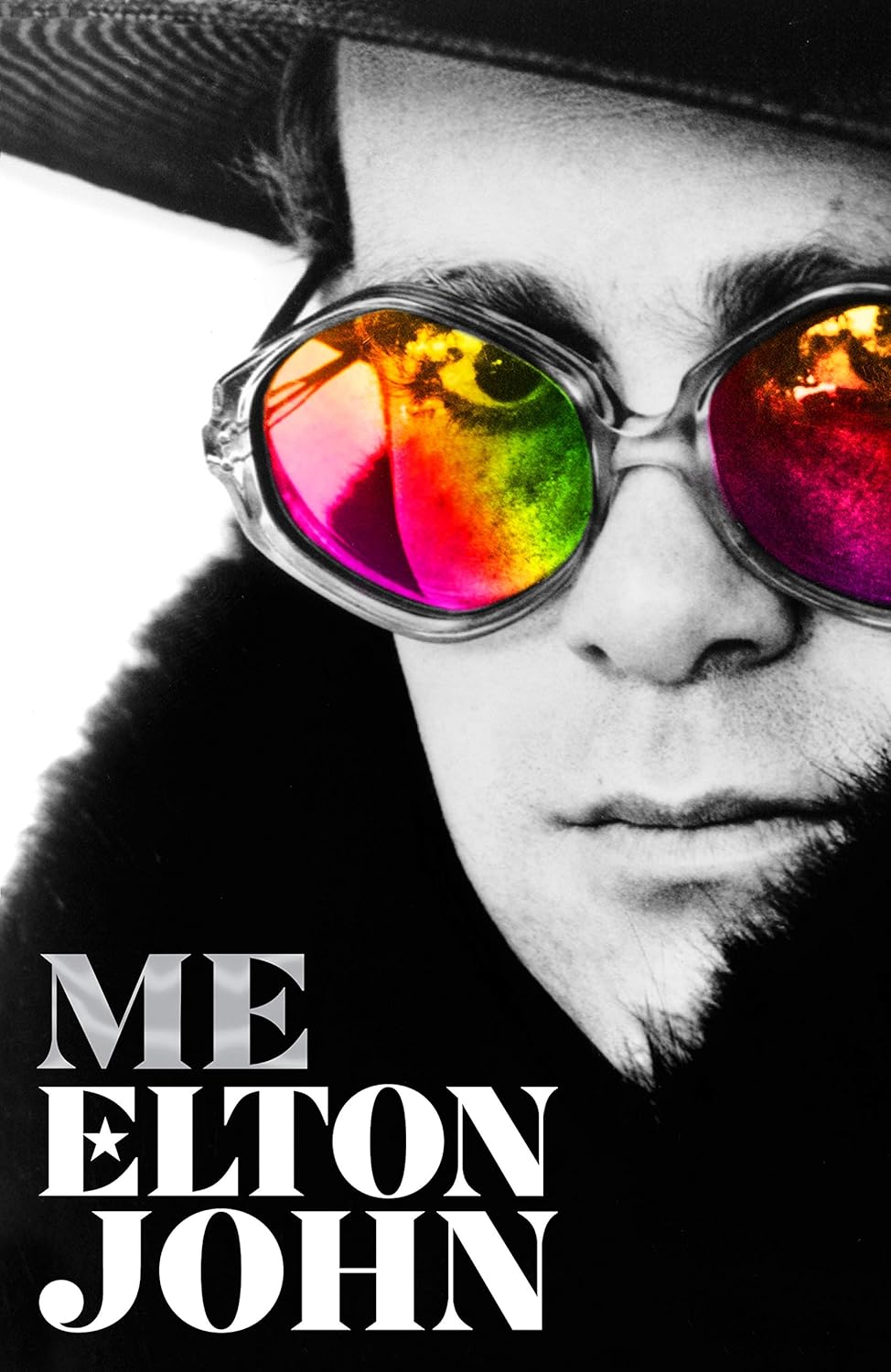 Black and white image of a person wearing colorful sunglasses with 'Me Elton John' text overlay. Readers across Bangladesh can order premium-quality books from Bookish Wonderland with online ordering with home delivery, while enjoying premium eye-soothing cream paper.