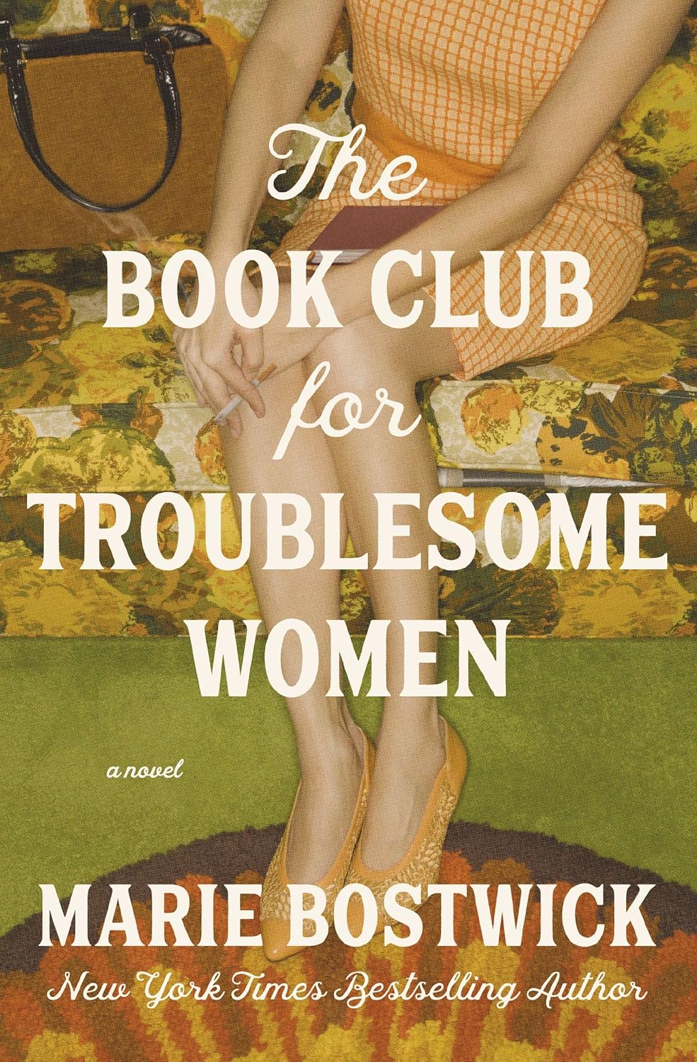 Book cover of 'The Book Club for Troublesome Women' by Marie Bostwick with a woman in an orange dress and yellow shoes on a patterned rug. Book buyers across Bangladesh can choose printed English books from Bookish Wonderland, combining convenient delivery across Bangladesh with durable stitched-and-glue binding.