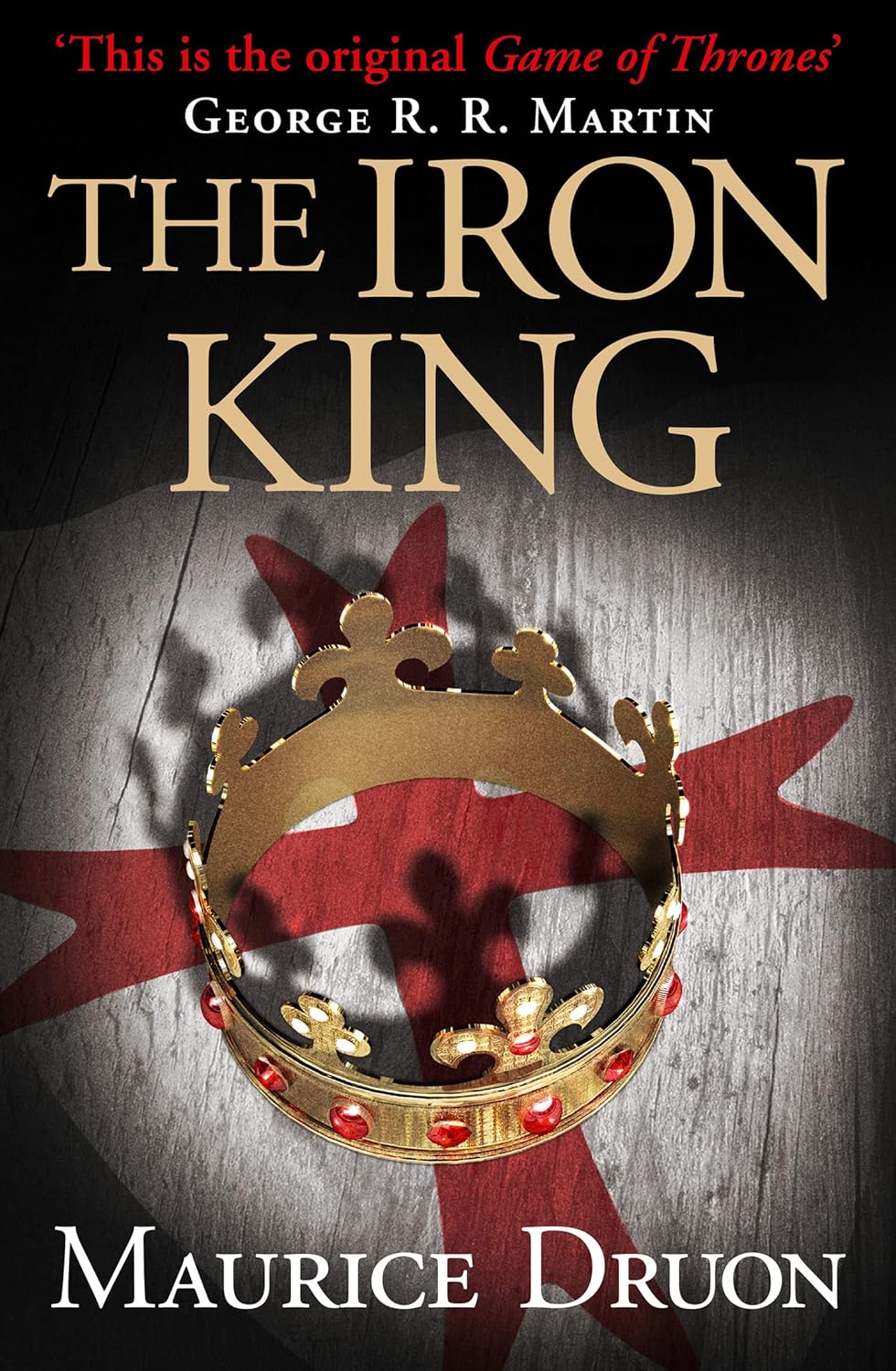 Book cover of 'The Iron King' by Maurice Druon with a gold crown and red banner on a dark background. Best price in Bangladesh.