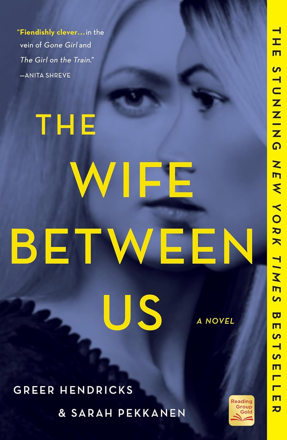Cover of The Wife Between Us by Greer Hendricks and Sarah Pekkanen featuring two overlapping women's faces in blue tones with bold yellow title text. The psychological thriller cover includes a review comparing it to Gone Girl and The Girl on the Train and highlights it as a New York Times bestseller. Bookish Wonderland simplifies online book buying in Bangladesh.