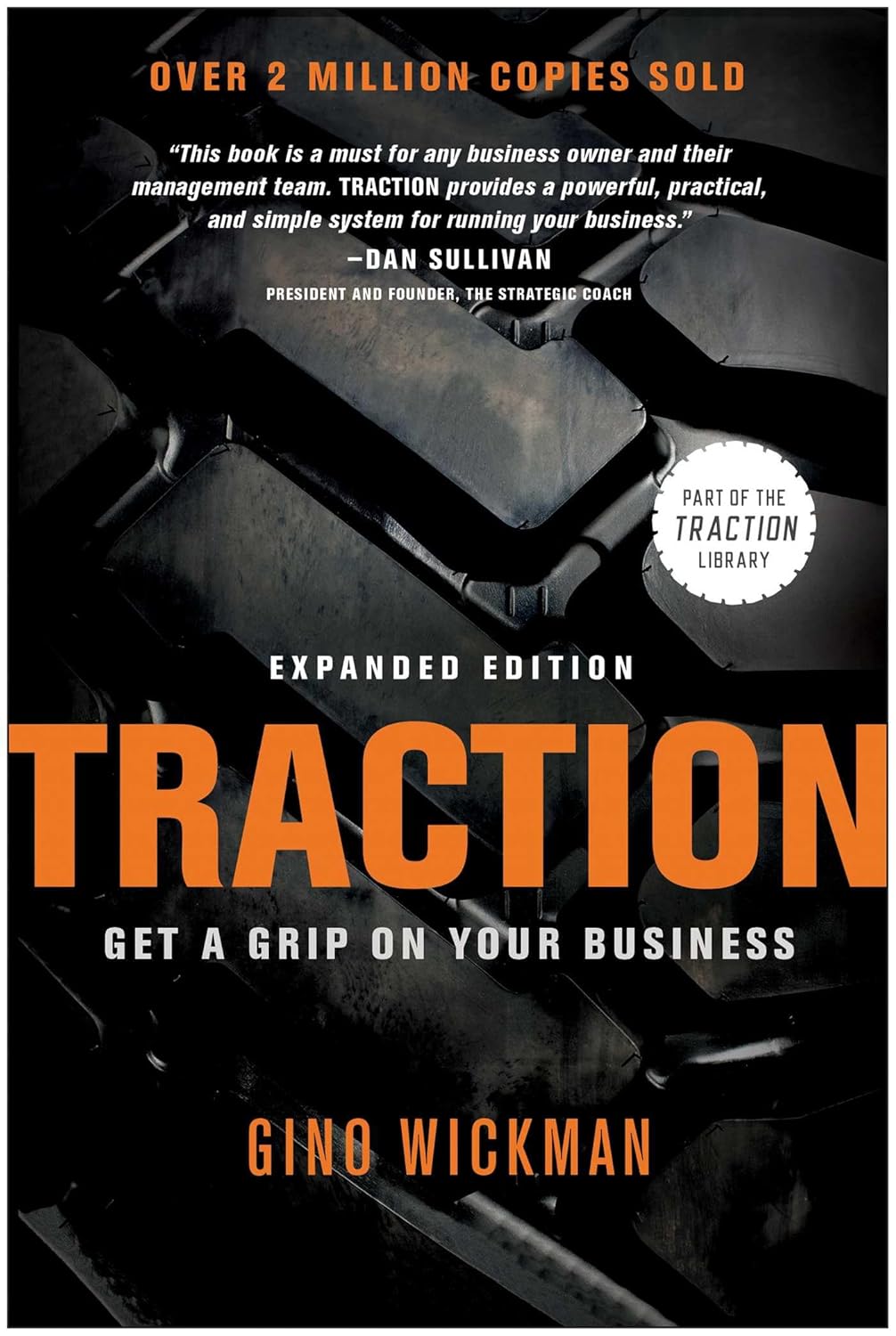 Book cover of 'Traction' by Gino Wickman with a black and white background and orange text,best print quality in Bangladesh.