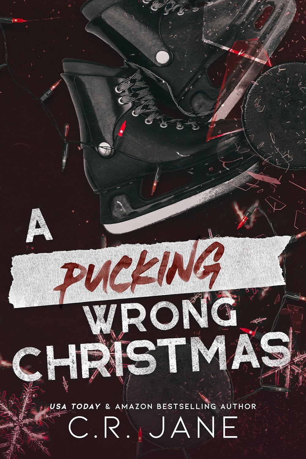 Book cover of 'A Pucking Wrong Christmas' with hockey skates and puck on a dark background. Book buyers throughout Bangladesh can purchase premium-quality books from Bookish Wonderland, combining convenient delivery across Bangladesh with sharp text and durable binding.