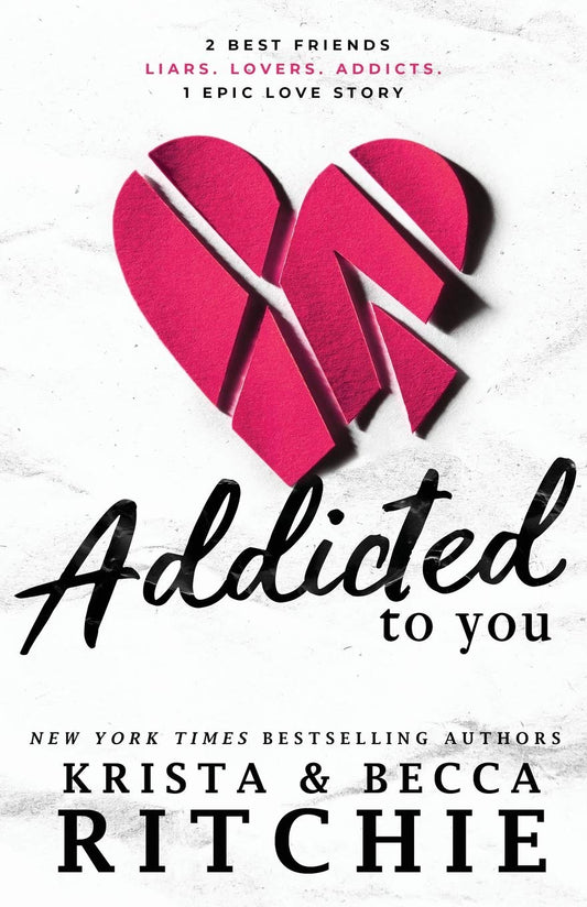 Book cover of 'Addicted to You' by Krista and Becca Ritchie with a pink heart design which is available in Bangladesh.