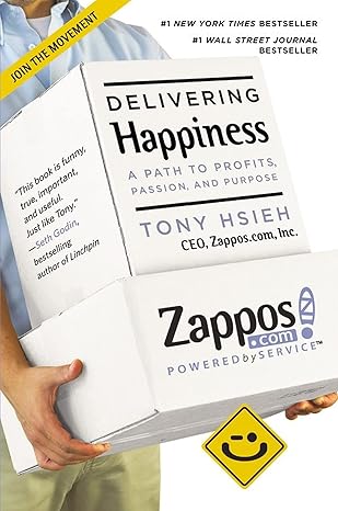 Book titled 'Delivering Happiness' by Tony Hsieh held by a person, with Zappos logo visible. Bookish Wonderland serves readers throughout Bangladesh with English books, making it simple to shop for online through fast delivery options in Dhaka and high-quality stitched and glue binding.