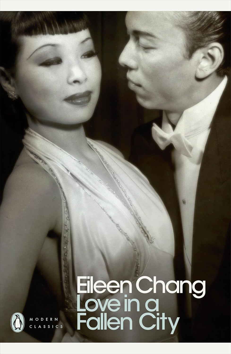 Book cover of 'Love in a Fallen City' by Eileen Chang featuring a black and white photo of a couple. Online shoppers across Bangladesh can find printed English books at Bookish Wonderland with urgent delivery options in Dhaka and editions featuring sharp text and durable binding.