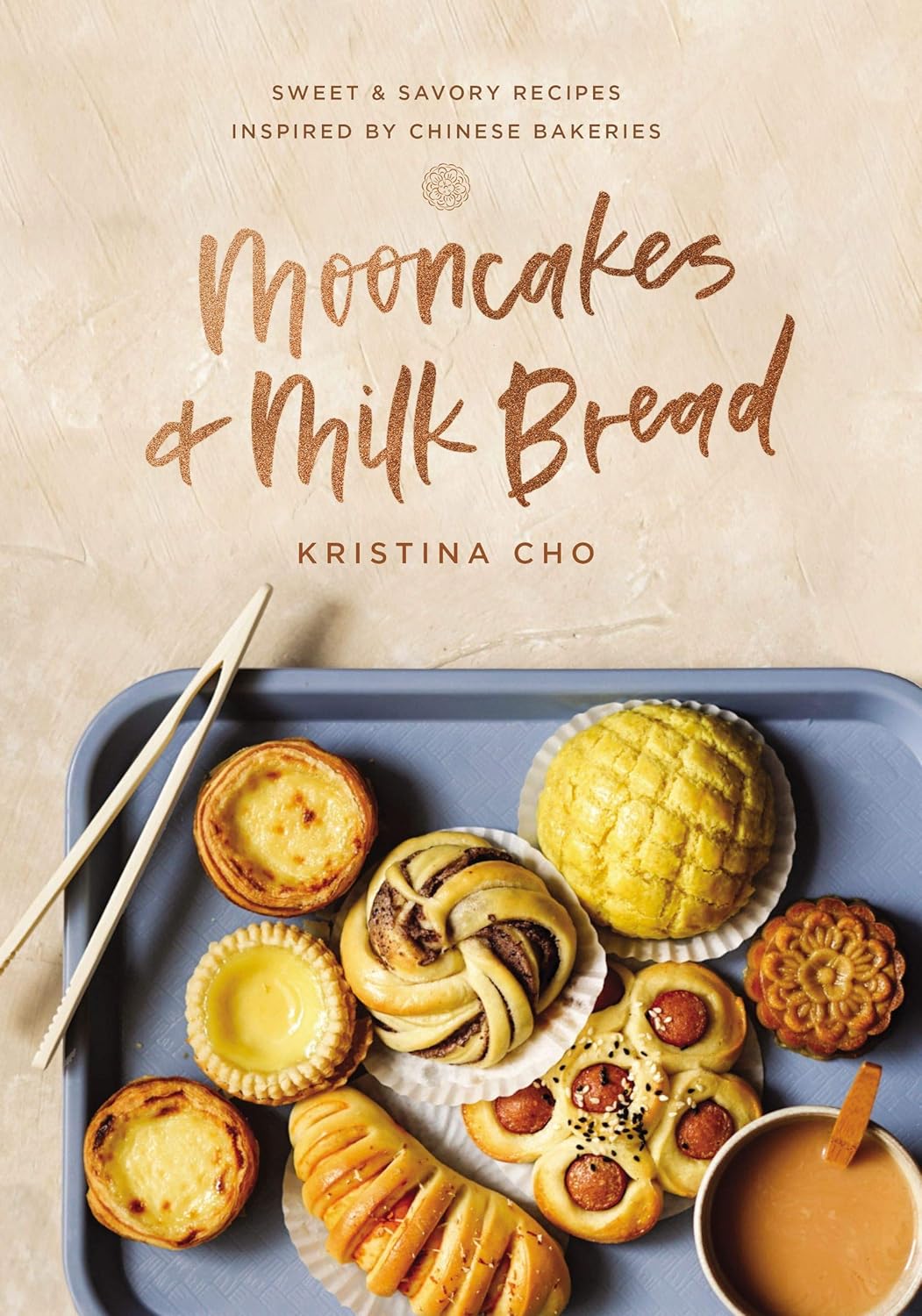 Book cover of 'Mooncakes & Milk Bread' with various mooncakes and a bowl of soup on a tray. Bookish Wonderland provides a convenient way for readers throughout Bangladesh to order reader-friendly printed books with online ordering with home delivery and high-quality stitched and glue binding.