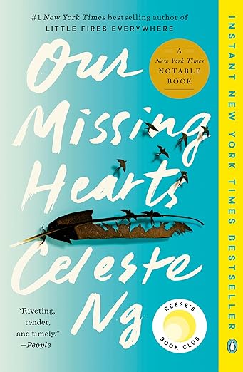 Book cover of 'Our Missing Hearts' by Celeste Ng with a blue background and yellow spine. Book buyers across Bangladesh can get reader-friendly printed books from Bookish Wonderland, combining fast delivery options in Dhaka with high-quality stitched and glue binding.