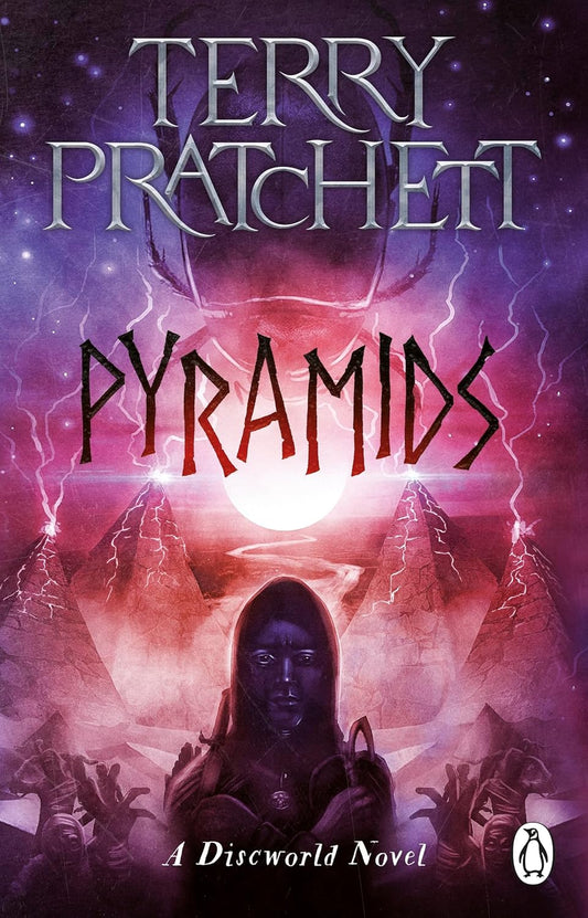 Book cover of 'Pyramids' by Terry Pratchett with a purple and pink gradient background. Best print quality in Bangladesh.

