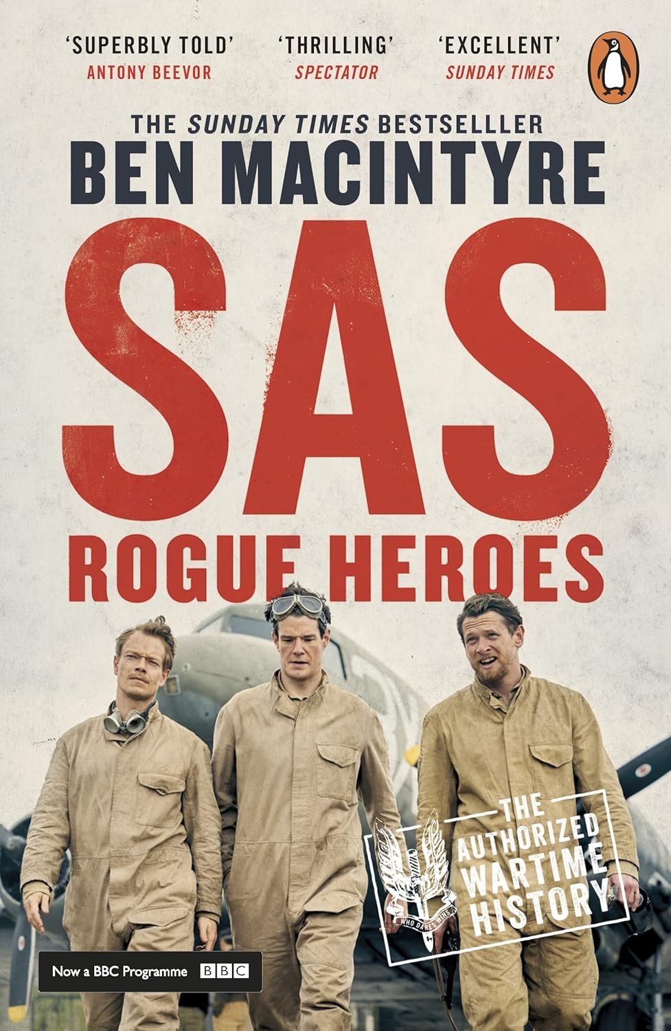 Book cover of 'SAS Rogue Heroes' by Ben Macintyre with three men in uniform and a vintage airplane in the background. Bookish Wonderland supports book lovers across Bangladesh who want to order premium-quality books, offering convenient delivery across Bangladesh plus high-quality stitched and glue binding.