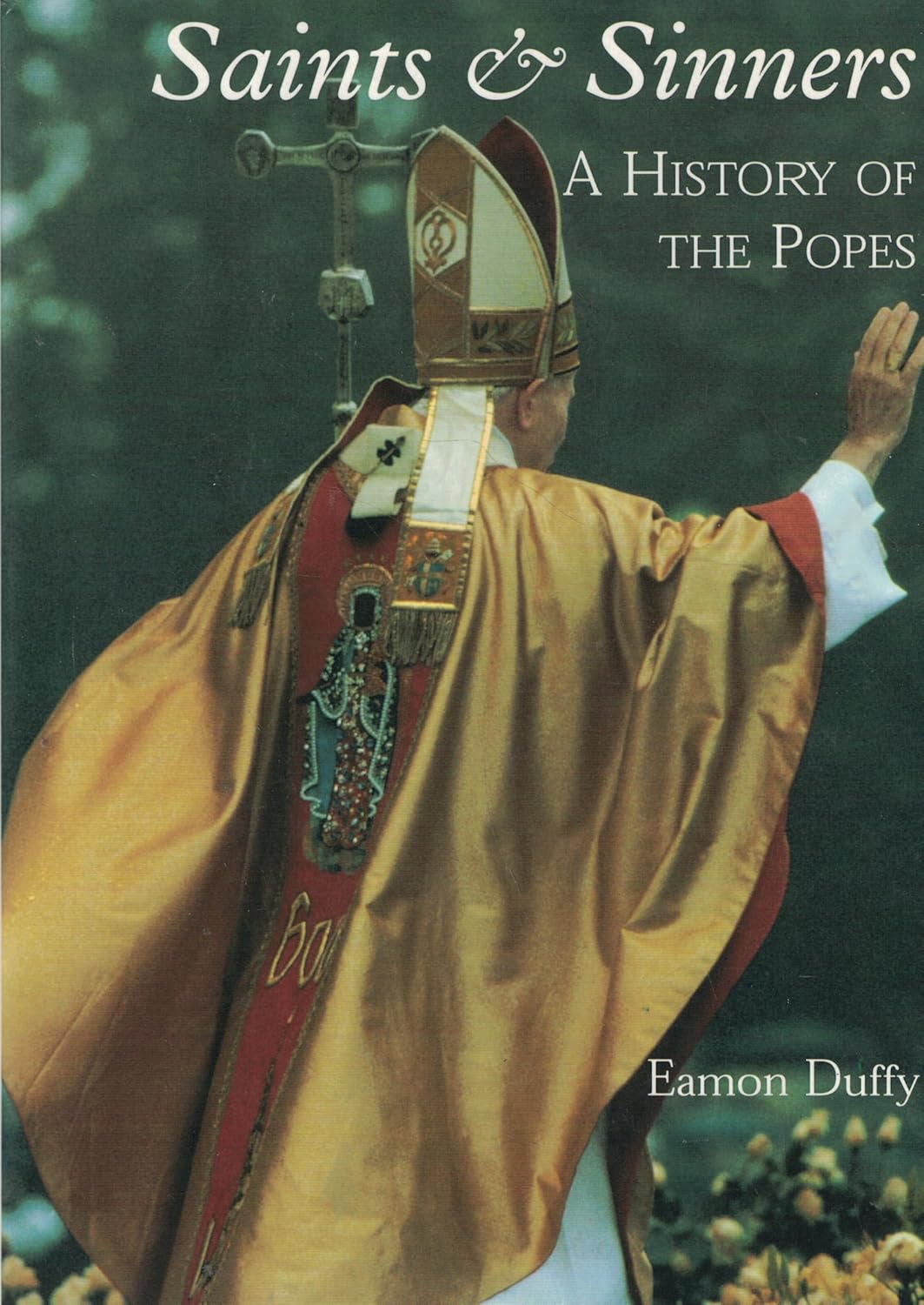 Book cover of 'Saints & Sinners: A History of the Popes' with a depiction of a pope in ornate vestments. Bookish Wonderland supports book lovers across Bangladesh who want to shop for English books, offering convenient delivery across Bangladesh plus reader-friendly cream paper.