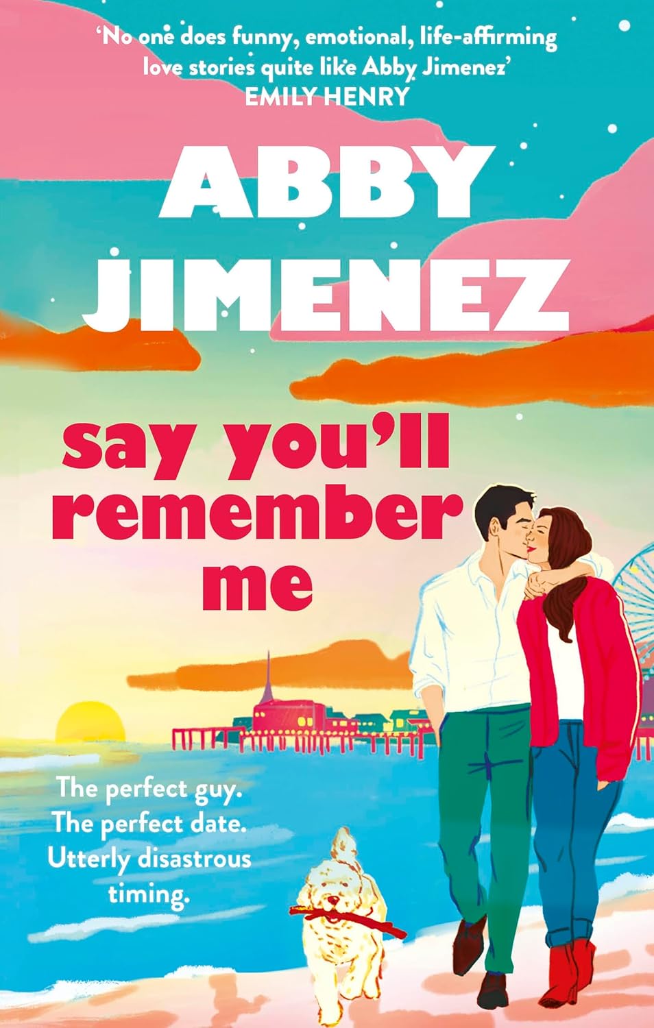 Book cover of 'Say You'll Remember Me' by Abby Jimenez with a couple and dog on a beach. Customers seeking books for everyday reading across Bangladesh can shop for them through Bookish Wonderland, supported by nationwide delivery and clear print with strong binding.