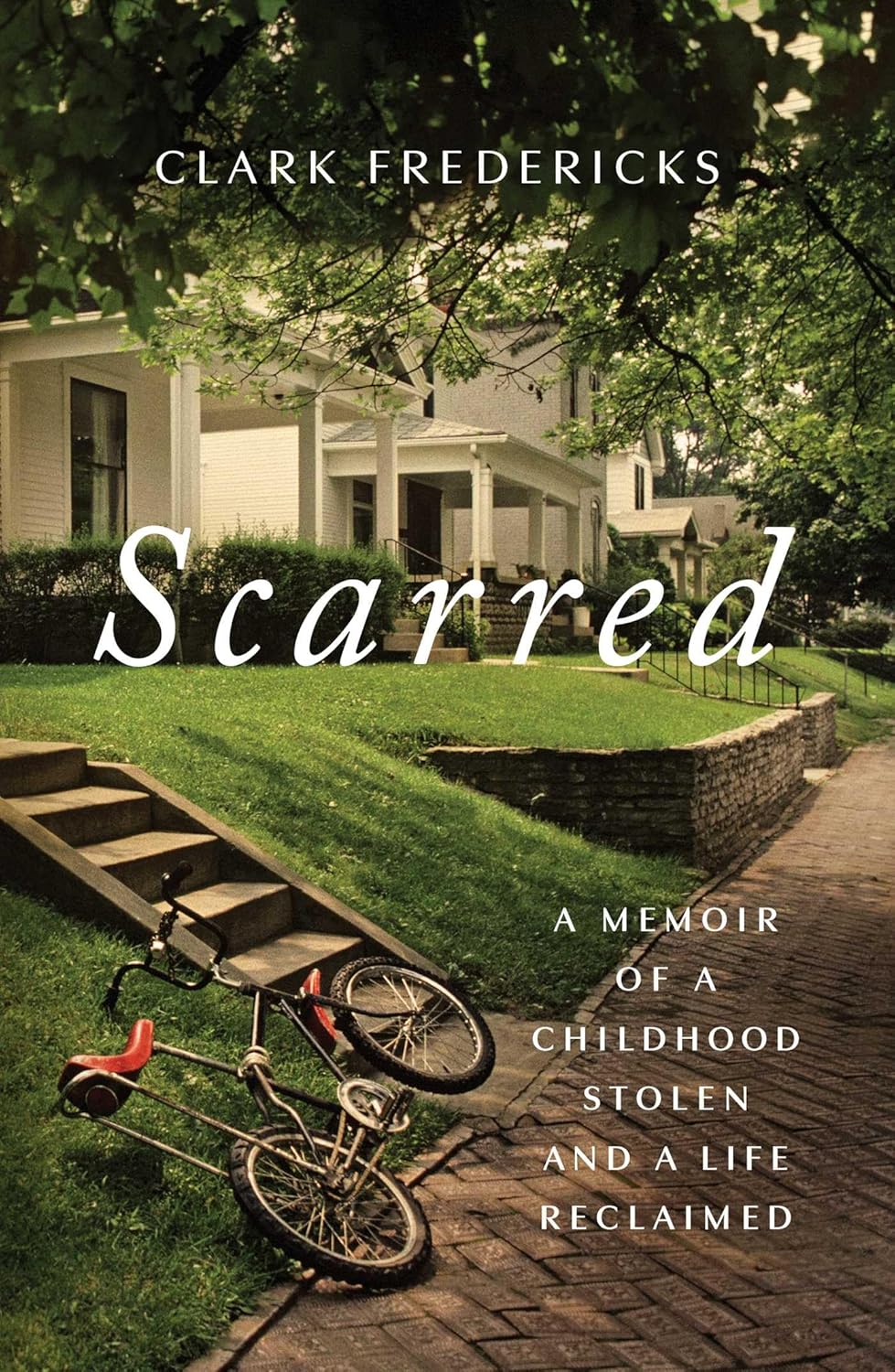 Book cover of 'Scarred' by Clark Fredericks with a bicycle on a path leading to a house. Bookish Wonderland supports book lovers throughout Bangladesh who want to order printed English books, offering delivery inside and outside Dhaka plus durable stitched-and-glue binding.