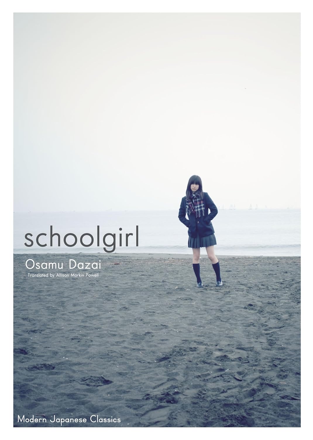 Book cover of 'schoolgirl' by Osamu Dazai with a person in a school uniform standing on a beach. Bookish Wonderland supports book lovers throughout Bangladesh who want to order printed English books, offering customer-friendly ordering and delivery plus sharp text and durable binding.