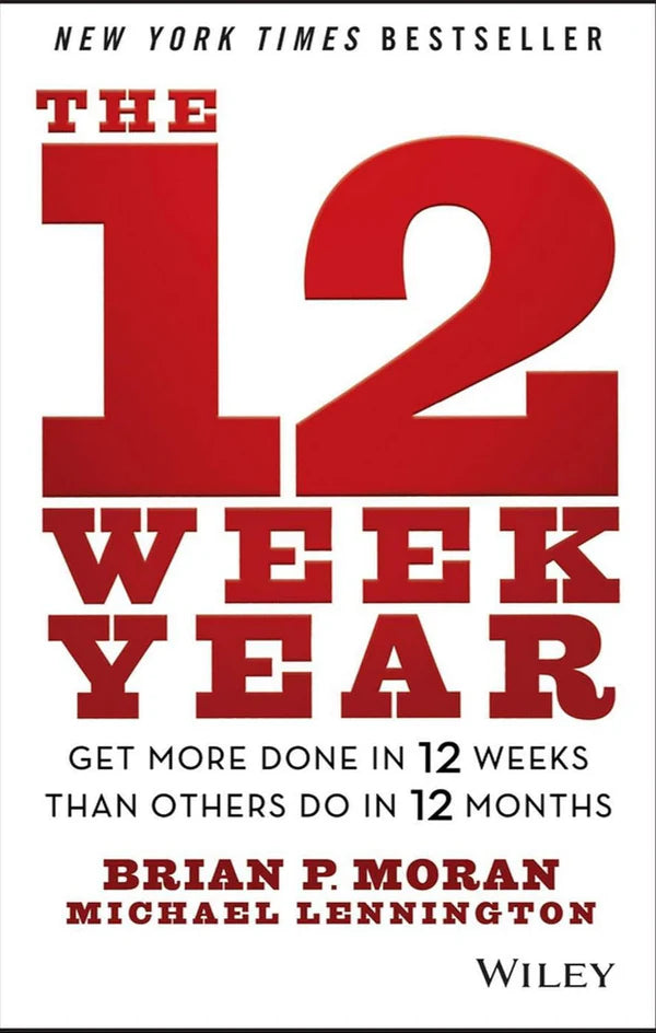 Book cover of 'The 12 Week Year' with red and white text on a black background. For customers across Bangladesh, Bookish Wonderland makes it easier to shop for premium-quality books through Cash on Delivery across Bangladesh and reader-friendly cream paper.