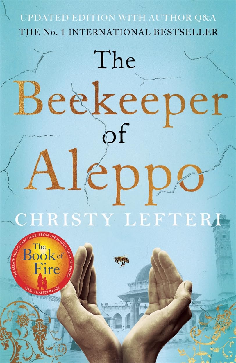 Book cover of 'The Beekeeper of Aleppo' by Christy Lefteri with hands holding a bee and a cityscape in the background. The Beekeeper of Aleppo by Christy Lefteri