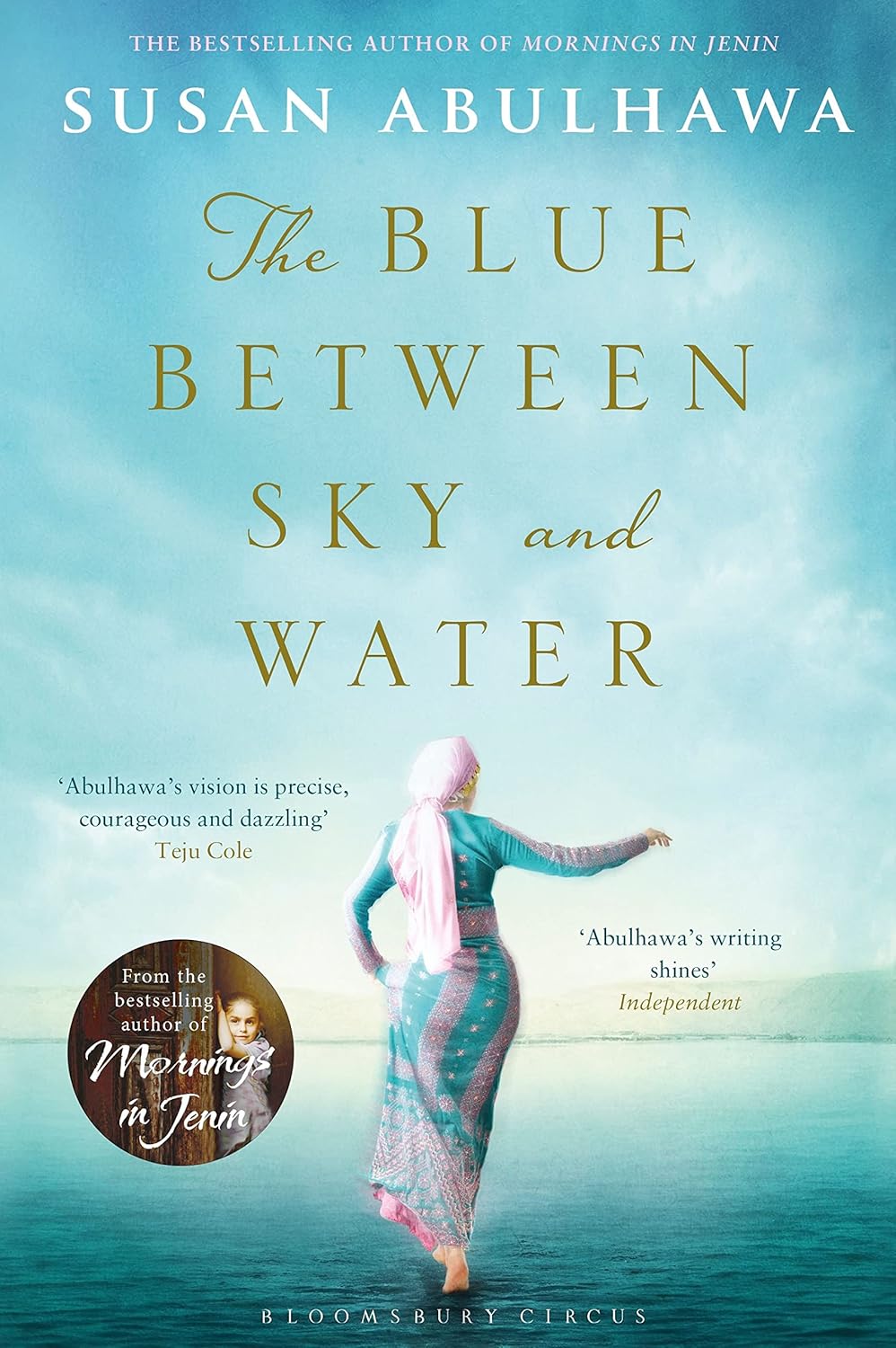 Book cover of 'The Blue Between Sky and Water' by Susan Abulhawa with a woman in a hijab standing on water. Readers across Bangladesh can buy reader-friendly printed books from Bookish Wonderland with urgent delivery options in Dhaka, while enjoying durable stitched-and-glue binding.