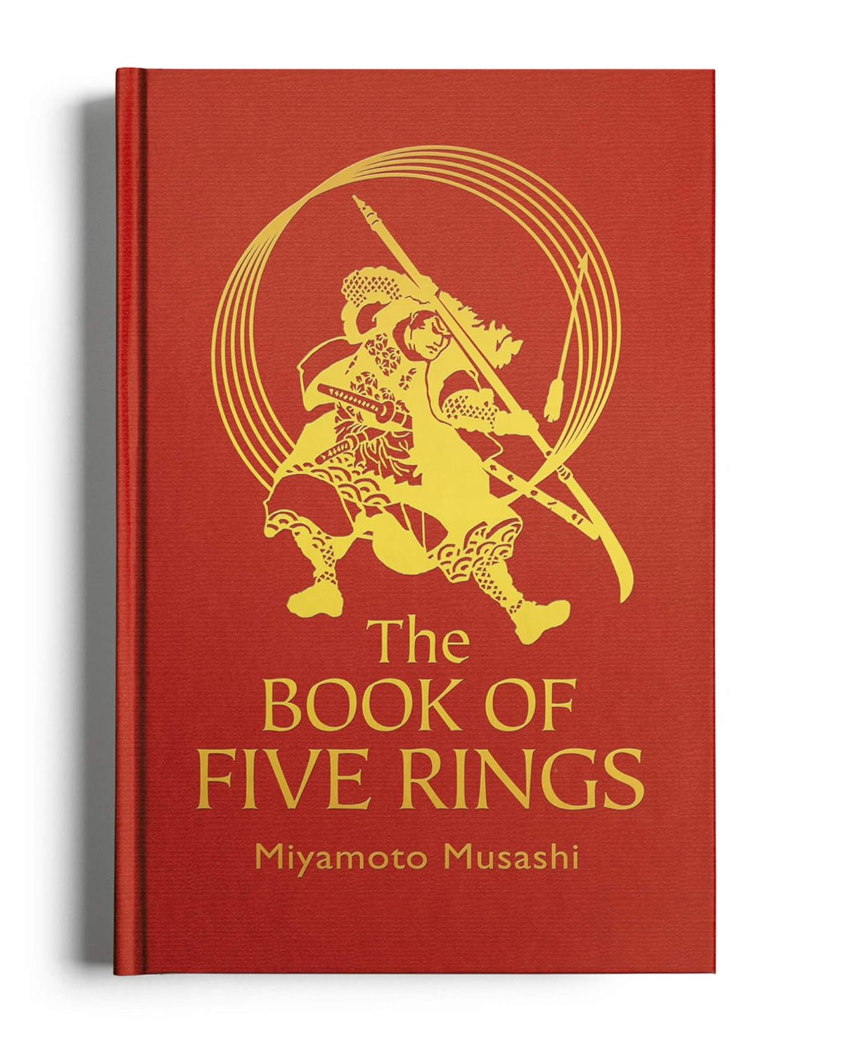 Book cover of 'The Book of Five Rings' with a red background and gold illustration. Readers across Bangladesh can get English books from Bookish Wonderland with delivery inside and outside Dhaka, while enjoying sharp text and durable binding.