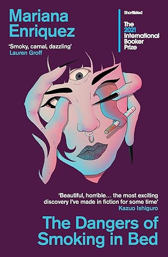 Book cover of 'The Dangers of Smoking in Bed' by Mariana Enriquez with a stylized face design on a purple background.Bookish Wonderland supports book lovers across Bangladesh who want to shop for books for everyday reading, offering urgent delivery options in Dhaka plus comfortable cream paper and clear printing.