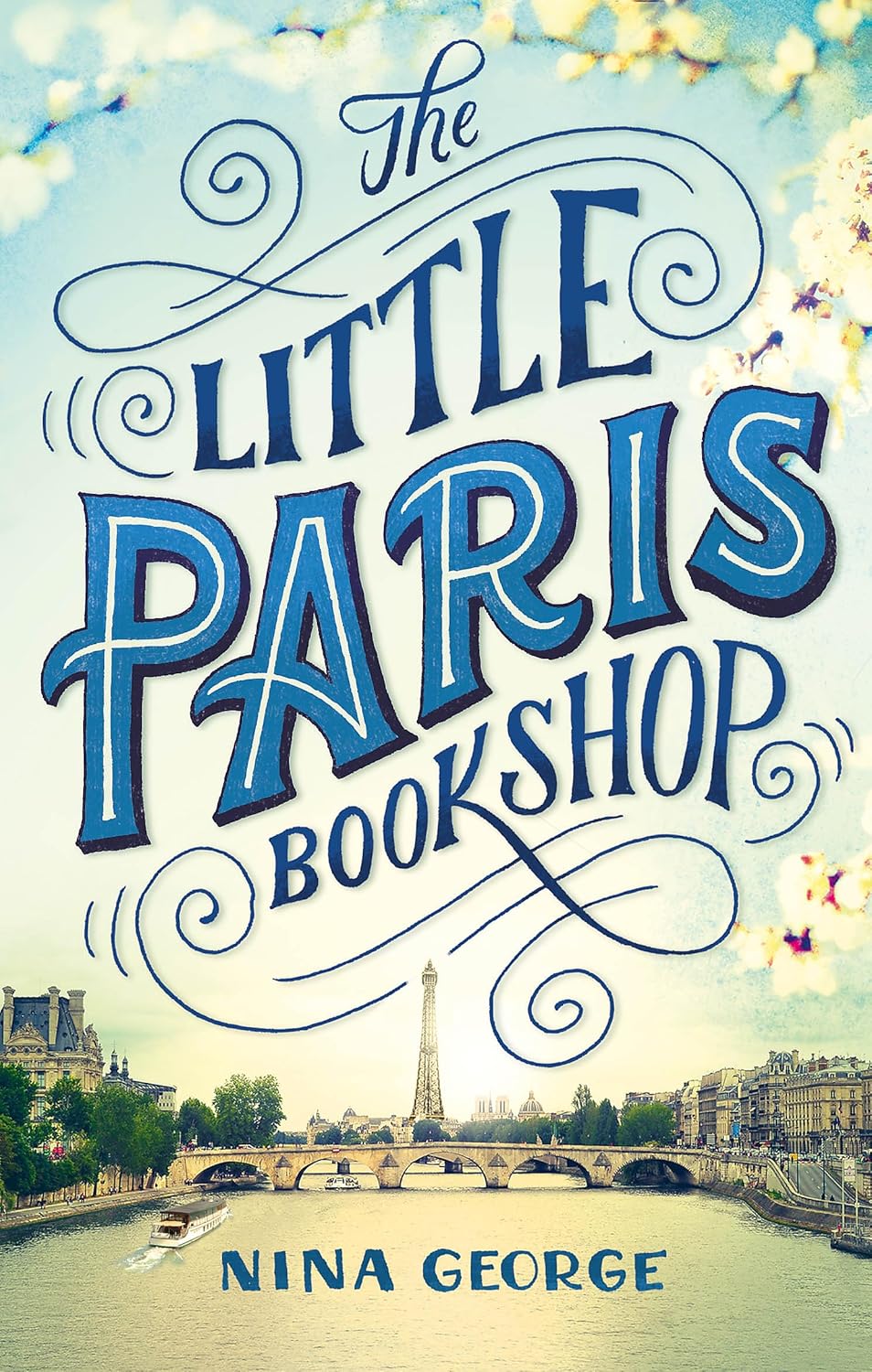 Book cover of 'The Little Paris Bookshop' with a scenic background of Paris.Bookish Wonderland serves readers throughout Bangladesh with printed English books, making it simple to choose online through convenient delivery across Bangladesh and comfortable cream paper and clear printing.