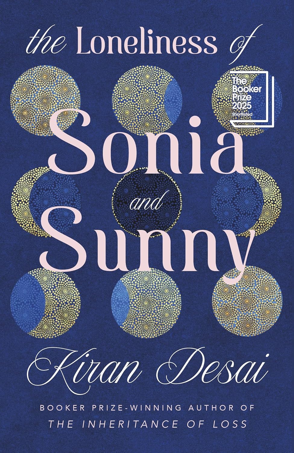 Book cover of 'The Loneliness of Sonia and Sunny' by Kiran Desai with decorative elements on a blue background.Bookish Wonderland provides a convenient way for readers throughout Bangladesh to order books for study and leisure with customer-friendly ordering and delivery and comfortable cream paper and clear printing.