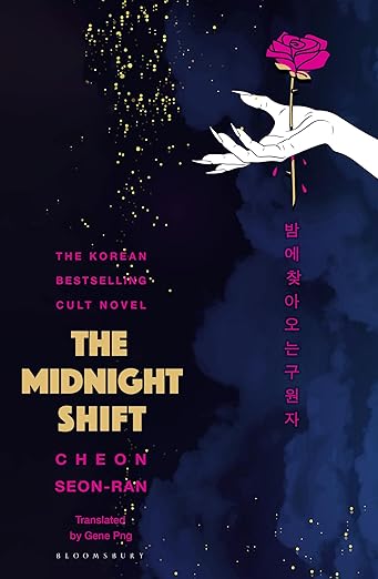 Book cover of 'The Midnight Shift' with a hand holding a pink rose against a dark background. Bookish Wonderland serves readers throughout Bangladesh with books for everyday reading, making it simple to find online through delivery inside and outside Dhaka and sharp text and durable binding.