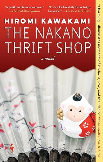 Book cover of 'The Nakano Thrift Shop' by Hiromi Kawakami with a small figurine and cherry blossoms in the background. Bookish Wonderland serves readers across Bangladesh with quality English books, making it simple to choose online through Cash on Delivery across Bangladesh and comfortable cream paper and clear printing.