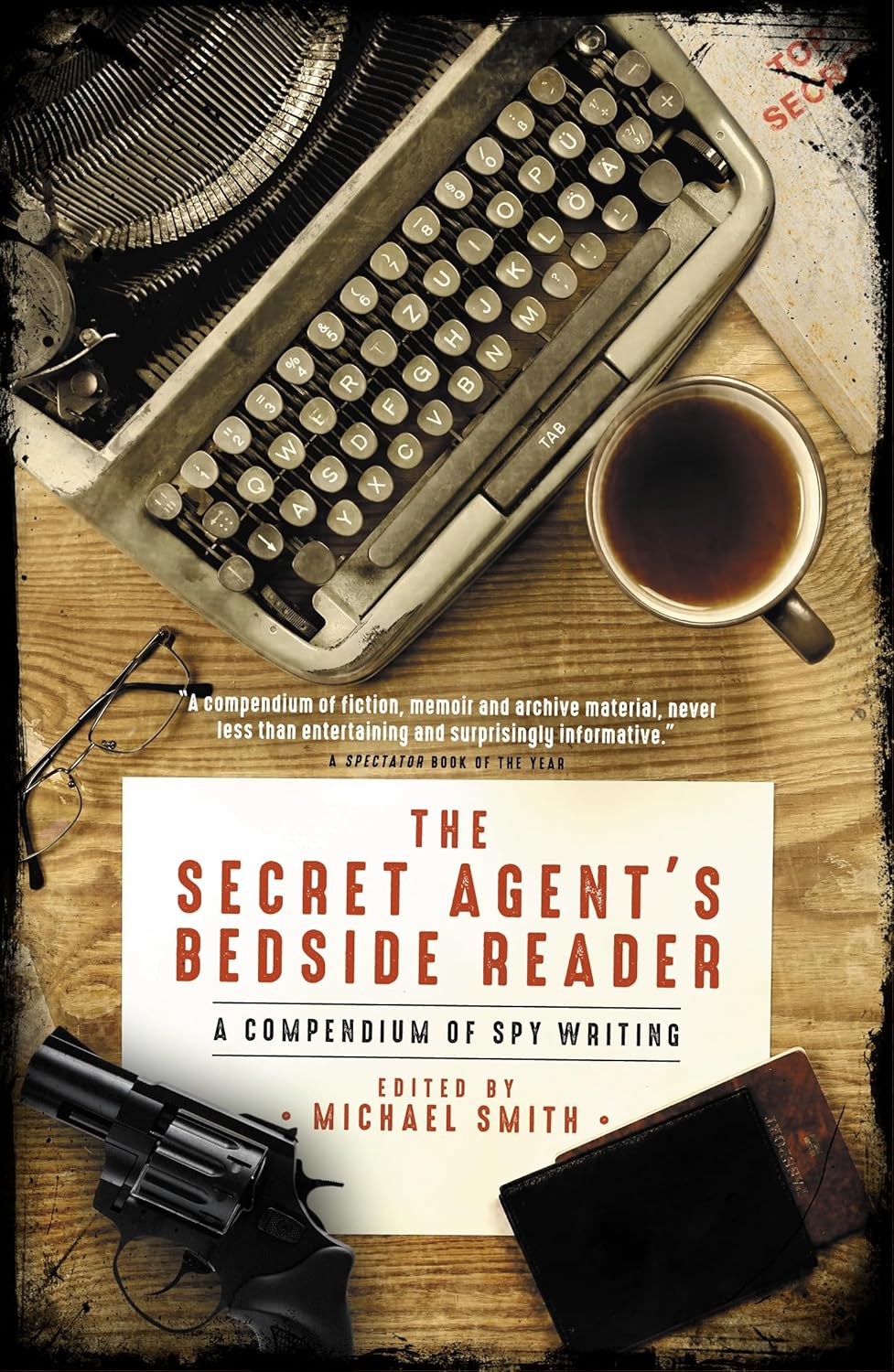 Book cover of 'The Secret Agent's Bedside Reader' with typewriter, coffee cup, and revolver on wooden surface. For online book buying throughout Bangladesh, Bookish Wonderland lets readers order books for everyday reading with fast delivery options in Dhaka and attention to clear print with strong binding.