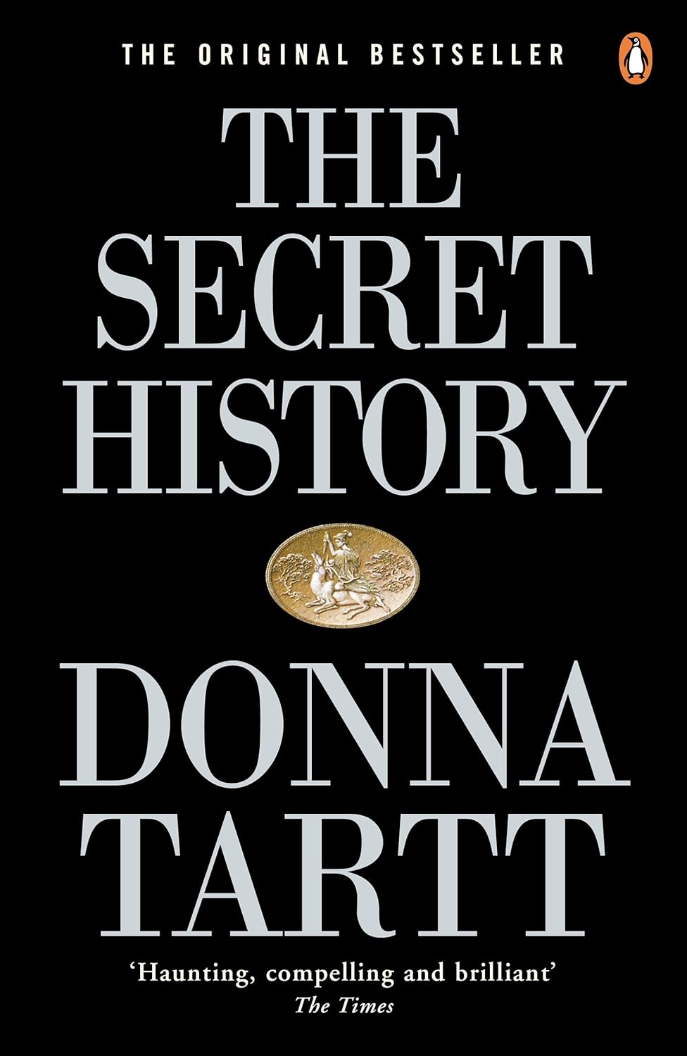 Book cover of 'The Secret History' by Donna Tartt with a black background and gold emblem. For online book buying throughout Bangladesh, Bookish Wonderland lets readers buy reader-friendly printed books with delivery inside and outside Dhaka and attention to sharp text and durable binding.