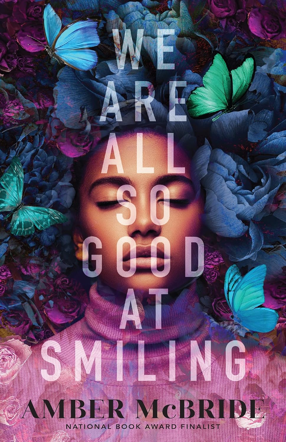 Book cover with a person surrounded by flowers and butterflies, featuring text 'WE ARE ALL SO GOOD AT SMILING' by Amber McBride.