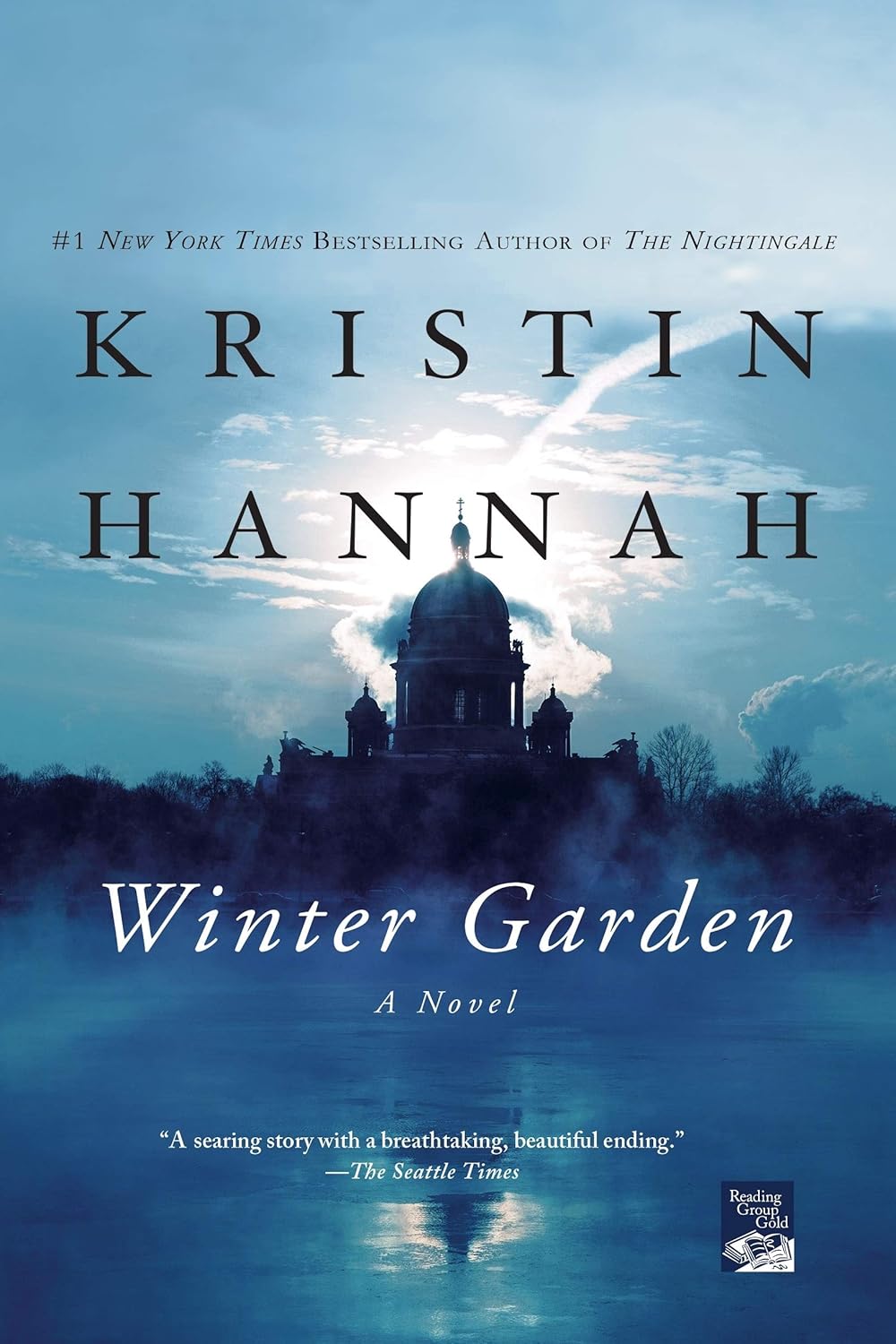Book cover of 'Winter Garden' by Kristin Hannah with a silhouette of a building and blue sky. available in BD