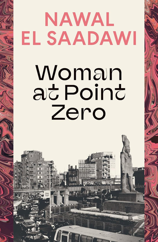 Book cover of 'Woman at Point Zero' by Nawal El Saadawi with a cityscape and statue on a pink and purple marbled background.