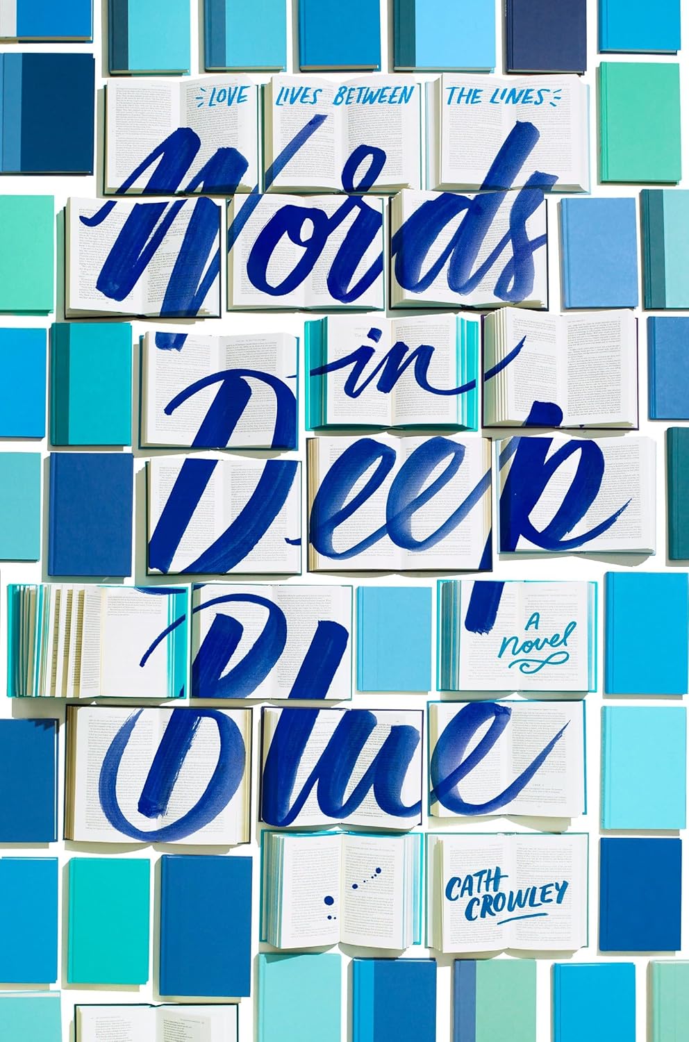 Book cover image of Words in Deep Blue by Cath Crowley, featuring open books arranged in a mosaic grid with blue lettering. Buy this popular young adult romance and literary fiction novel online in Bangladesh at the best price with fast home delivery and cash on delivery across BD from Bookish Wonderland.